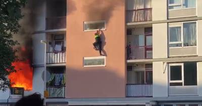 Agent ernstig gewond na sprong uit brandende flat