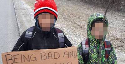 Moeder laat zonen 7 km in vrieskou naar school wandelen met bord om nek