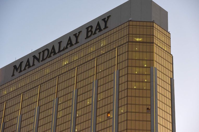 (FILES) In this file photo taken on October 4, 2017 broken windows that Stephen Paddock fired from in the The Mandalay Bay Hotel and Casino are seen in Las Vegas, Nevada. - A US court on September 30, 2020 approved an $800 million settlement for victims of America's worst mass shooting -- a rampage that left 58 dead and more than 800 wounded in Las Vegas. In the October 2017 massacre, a man named Stephen Paddock opened fire with high-powered rifles from the 32nd floor of the Mandalay Bay Resort and Casino, unleashing more than 1,000 rounds as he mowed down people among a crowd attending an outdoor country music festival. (Photo by Robyn Beck / AFP)